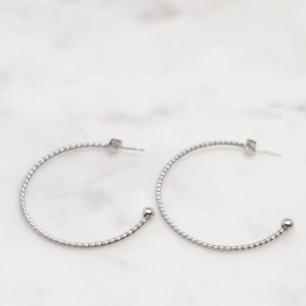 Boucles d'oreilles créoles tressées argentées